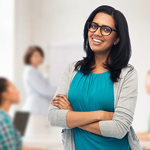 A women is smiling for a photo that will be used for her profile.