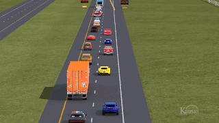 Vehicles driving in traffic, merging to one lane