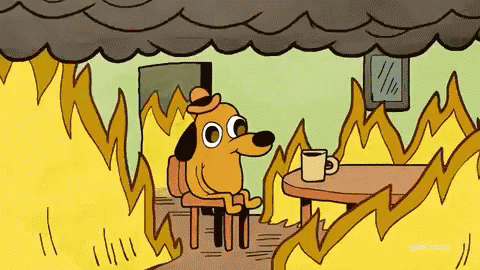 Cartoon dog drinking coffee surrounded by flames saying "this is fine."